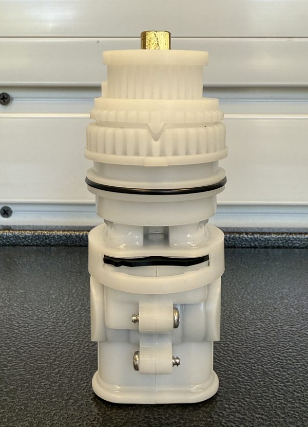 Replacement for Gerber 97-022 and 97-014 Safetemp cartridge: white stem and bonnet seated on the pressure balance spool, brass stem at the top