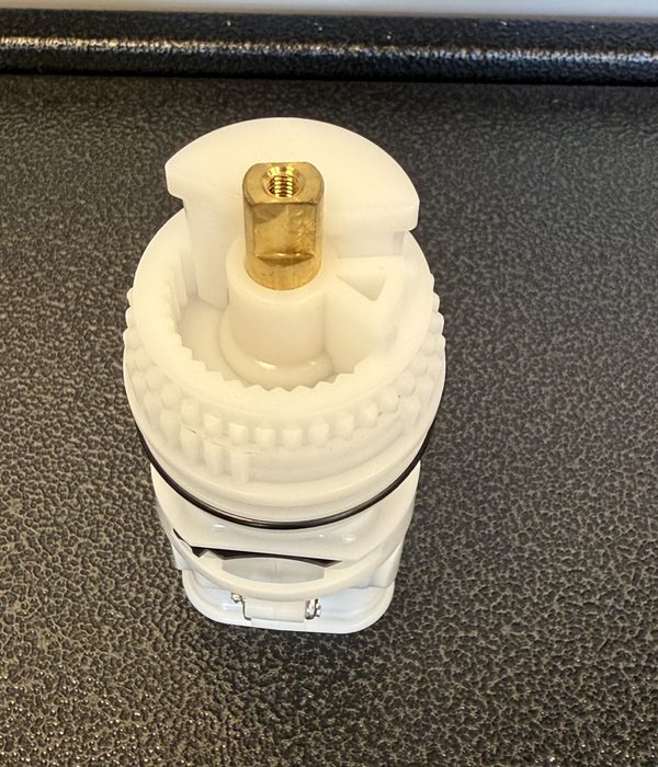 Top view of the replacement for Gerber 97-022: brass stem end inside the white bonnet