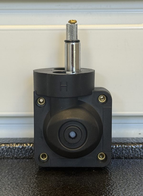 Replacement for Grohe 47080000 pressure balance cartridge: black body with a square four-hole flange, an H mark, and a chrome-sleeved stem with a splined tip