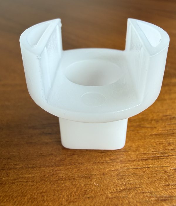 White plastic twist tool for Moen 1200 and 1225 cartridges: two prongs over a round cup, square drive below